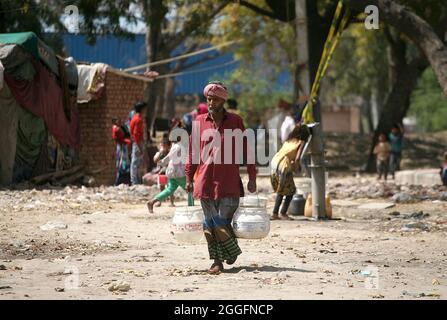 A general view of a slum area near Shakurbasti Railway station in New Delhi, India. This slum is situated on the railway's land. Stock Photo