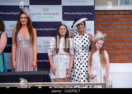 Windsor, Berkshire, UK. 28th August, 2021. Finalists in the Best Dressed Competition at Royal Windsor Racecourse Ladies Day. Credit: Maureen McLean/Alamy Stock Photo