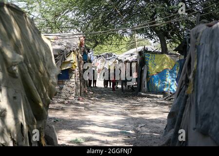 A general view of a slum area near Shakurbasti Railway station in New Delhi, India. This slum is situated on the railway's land. Stock Photo