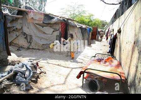 A general view of a slum area near Shakurbasti Railway station in New Delhi, India. This slum is situated on the railway's land. Stock Photo