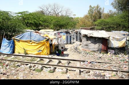 A general view of a slum area near Shakurbasti Railway station in New Delhi, India. This slum is situated on the railway's land. Stock Photo