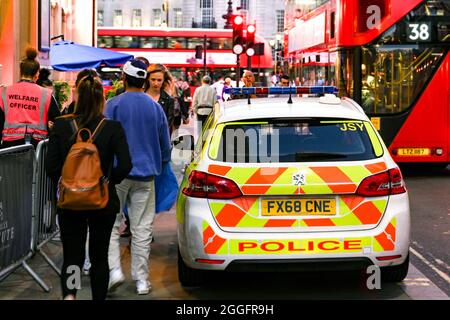 London, England - August 2021: Police patrol car parked on the side of the road in central London Stock Photo