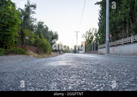 concept of hit the road, close up of a fresh asphalt road to drive Stock Photo
