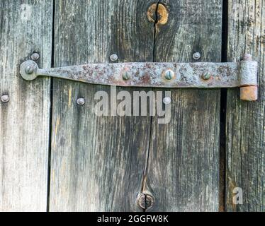 An old hinge on a barn Stock Photo