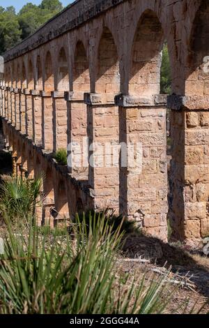 A view to the arches of the ancient Roman Aqueduct in Tarragona. Stock Photo