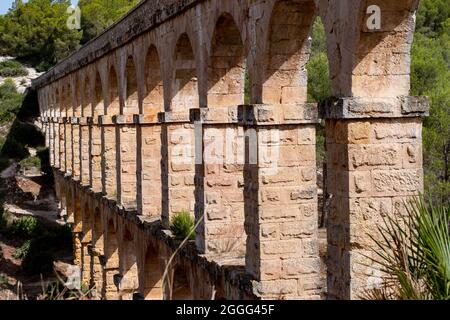 A view to the arches of the ancient Roman Aqueduct in Tarragona. Stock Photo