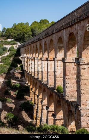 A view to the arches of the ancient Roman Aqueduct in Tarragona. Stock Photo