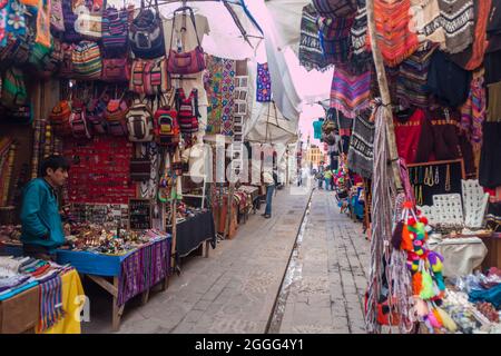 PISAC, PERU - MAY 22, 2015: Famous indigenous market in Pisac, Sacred Valley of Incas, Peru. Stock Photo