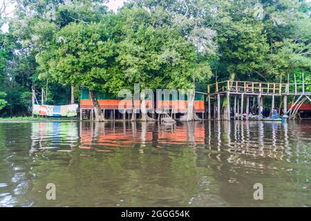 Riverside tourist lodge on river Yacumo, used for Pampa animal watching tours, Bolivia. Stock Photo