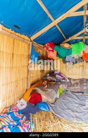 TITICACA, PERU - MAY 15, 2015: Interior of a reed house on Uros floating islands, Titicaca lake, Peru Stock Photo