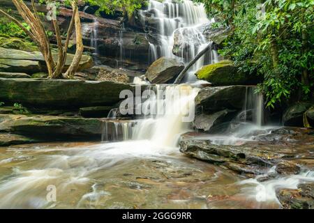 high spring flow at lower somersby falls near gosford on the nsw central coast Stock Photo