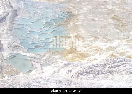 Background texture with abstract pattern in pastel natural colors. Pamukkale calcium travertine in Turkey, top view. Stock Photo