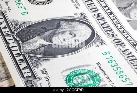 Macro close up on the design surface of 1 dollar notes. Banknotes of the United States America. Wallpaper background money. Detailed currency closeup. Stock Photo