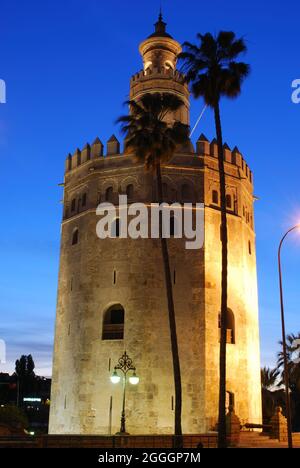 View of the Tower of Gold (Torre del Oro) at dusk, Seville, Spain. Stock Photo