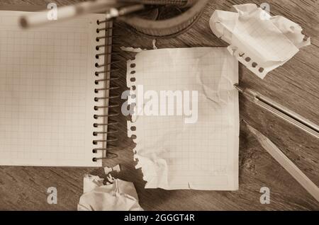 Crumpled pages and notebook Stock Photo