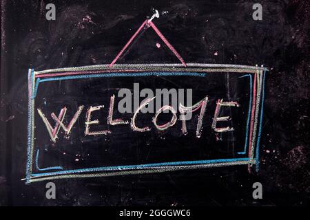 Graphical representation of the writing, welcome, written with chalk on blackboard