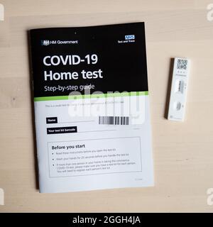 Positive Covid-19 test result. A positive lateral flow corona virus test kit as provided by the UK government via the NHS. Stock Photo