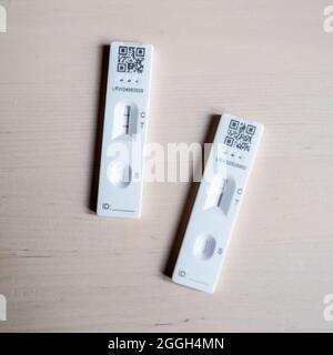 UK Covid test, positive negative results. The test results of both a positive and negative UK NHS COVID-19 home test kit. Stock Photo