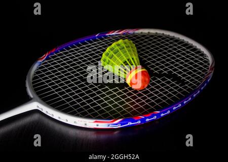 Badminton racket and shuttlecock isolated on black Stock Photo