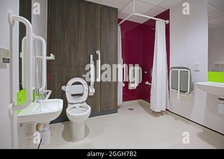 Interior of a disabled toilet and shower room in a new London health centre. Shows accessible shower. Stock Photo