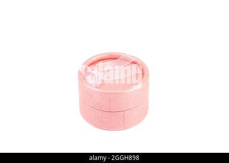 Round pink gift box isolated on white background. Copy space. Stock Photo