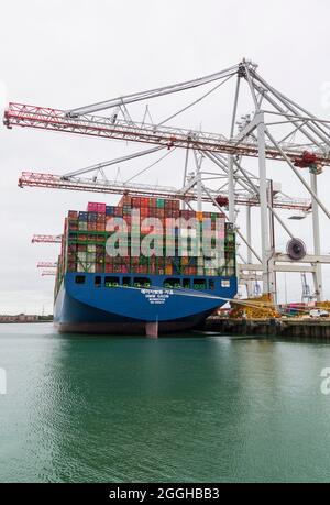 Cargo container crates on HMM Gaon Monrovia moored at Southampton docks, Hampshire UK in August - shipping containers freight Stock Photo