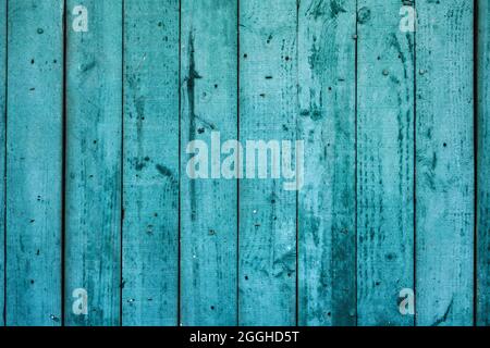 Old weathered turquoise colored wooden wall, rustic background or texture Stock Photo