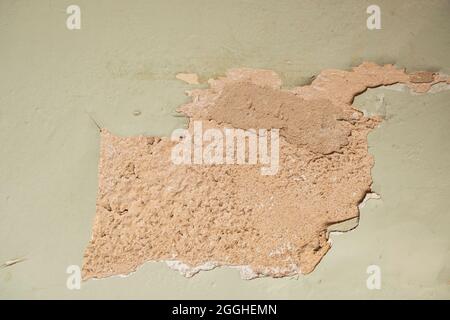 Light green wall peeling paint. Stock Photo