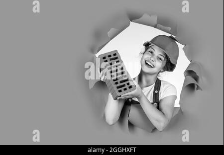 Real professional. kid wear helmet on construction site. teen girl ...