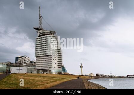 Bremerhaven, Germany - August 6 2019: Promenade with Klimahaus museum, Conference Center and Atlantic Hotel Sail City a stormy day of summer Stock Photo