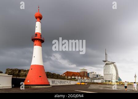 Bremerhaven, Germany - August 6 2019: Willy Brandt Platz and promenade with Klimahaus museum, Conference Center and Atlantic Hotel Sail City a stormy Stock Photo