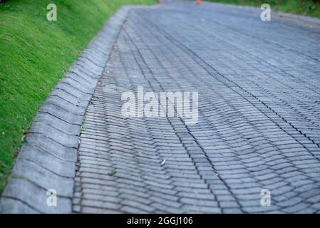 Perspective View Monotone Gray Brick Stone Pavement on The Ground for Street Road. Sidewalk, Driveway, Pavers, Pavement in Vintage Design Ground Floor Stock Photo