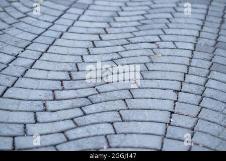 Perspective View Monotone Gray Brick Stone Pavement on The Ground for Street Road. Sidewalk, Driveway, Pavers, Pavement in Vintage Design Ground Floor Stock Photo