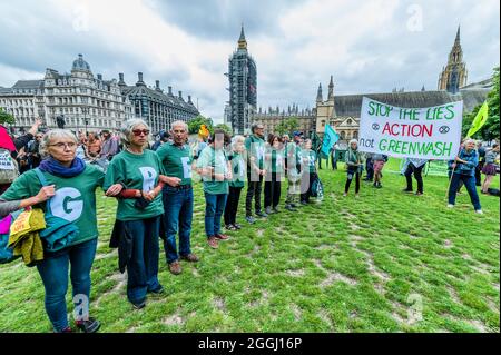 London, UK. 1st Sep, 2021. Gathering on Parliament Square - Extinction Rebellion continues its two weeks with a Greenwash protest starting in Parliament Square, under the overalll Impossible Rebellion name. Credit: Guy Bell/Alamy Live News Stock Photo