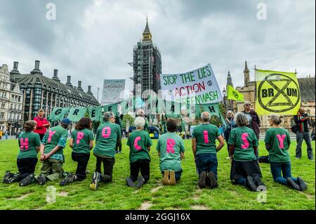 London, UK. 1st Sep, 2021. Gathering on Parliament Square - Extinction Rebellion continues its two weeks with a Greenwash protest starting in Parliament Square, under the overalll Impossible Rebellion name. Credit: Guy Bell/Alamy Live News Stock Photo