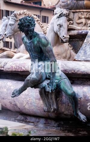 Bronze satyr statue and marble horses drawing Neptune's chariot at Neptunes Fountain in Florence, Italy. Stock Photo