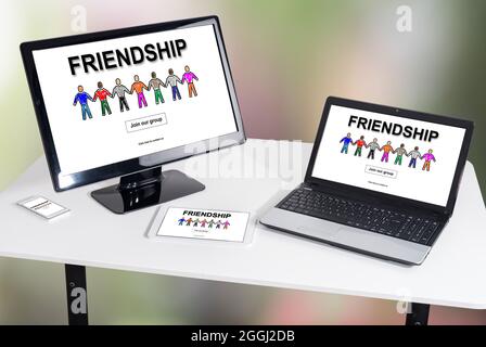 Friendship concept shown on different information technology devices Stock Photo