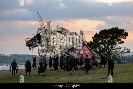 The Hatchling, a gigantic dragon puppet, looks longingly out over Plymouth Sound. The giant puppet and street theatre is a part of the Mayflower 400 C Stock Photo