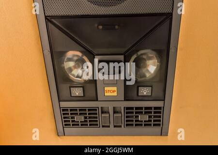 System and control panel for passengers in a tourist bus with buttons for adjusting the air conditioner, sound, light and speakers in the cabin of tra Stock Photo