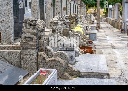 Rows of stone tombstones in a public cemetery Stock Photo