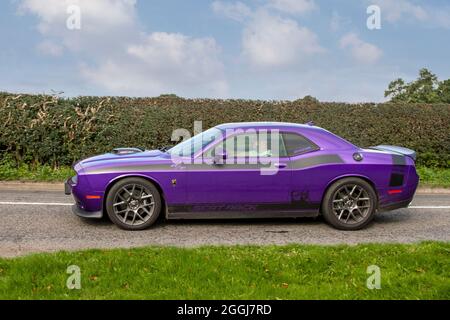 2019 purple American Dodge (USA) 5400cc muscle car en-route to Capesthorne Hall classic August car show, Cheshire, UK Stock Photo
