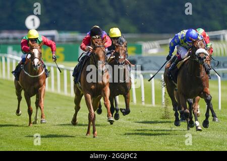 File photo dated 16-07-2021 of Pat Dobbs riding Intelligentsia (centre, red sleeves) on their way to winning The bet365 EBF Maiden Fillies' Stakes at Newbury Racecourse. Issue date: Wednesday September 1, 2021. Stock Photo