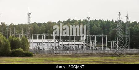 Small power substation with power lines and high voltage. Stock Photo