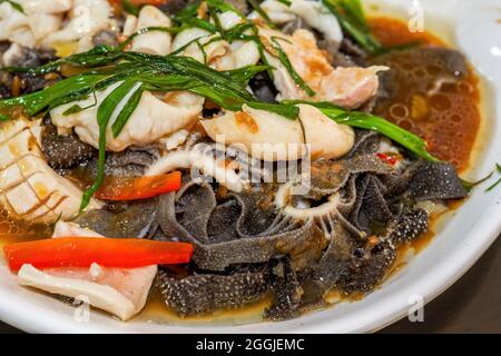 A delicious Chinese dish, boiled tripe and sirloin with film and beef Stock Photo