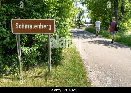 Europe, Germany, Baden-Wuerttemberg, Swabian-Franconian Forest Nature Park, Welzheim, hikers on a paved path just before Schmalenberg Stock Photo