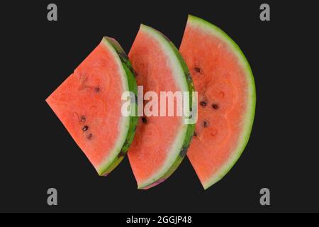 Sliced watermelon on black background. Pieces of watermelon isolated on black background. Flat lay. Stock Photo