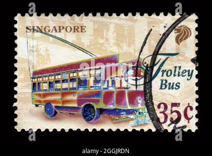 Stamp printed in Singapore shows image of the Trolley Bus. Stock Photo