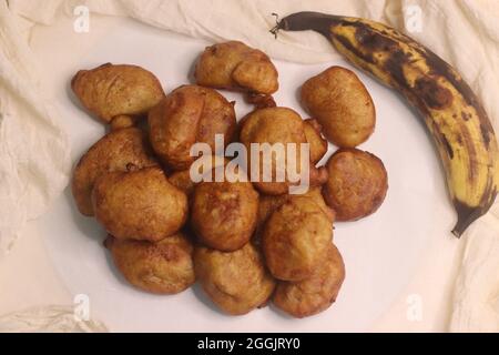 Plantain puff puff is a version of popular African street food puff puff made with overripe plantains. It is a great way to use up overripe plantains. Stock Photo