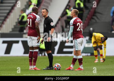 London, UK. 31st Aug, 2021. Angelo Ogbonna of West Ham United is spoken to by referee Stuart Attwell during the Premier League match between West Ham United and Crystal Palace at the London Stadium, Queen Elizabeth Olympic Park, London, England on 28 August 2021. Photo by Ken Sparks. Editorial use only, license required for commercial use. No use in betting, games or a single club/league/player publications. Credit: UK Sports Pics Ltd/Alamy Live News Stock Photo