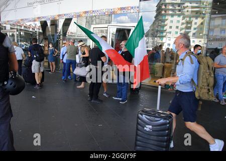 Entry into force of the possession of the green pass (certification of vaccination against covid-19) on long-distance trains. On the instructions of Interior Minister Lamorgese, to avoid protests of no-vax and no-green passes, all major Italian railway stations are manned by a large number of police forces . At the station of Naples closed all the various accesses. One access only for the entrance and one only for the exit from the station. Travelers forced to a long walk from the parking lot to the entrance and exit area. I've seen a lot of police and financial police officers. (Photo by Pas Stock Photo